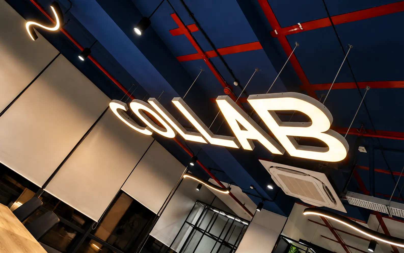Custom Ceiling Lights — Illumination and signage integrated into the ceiling plane.